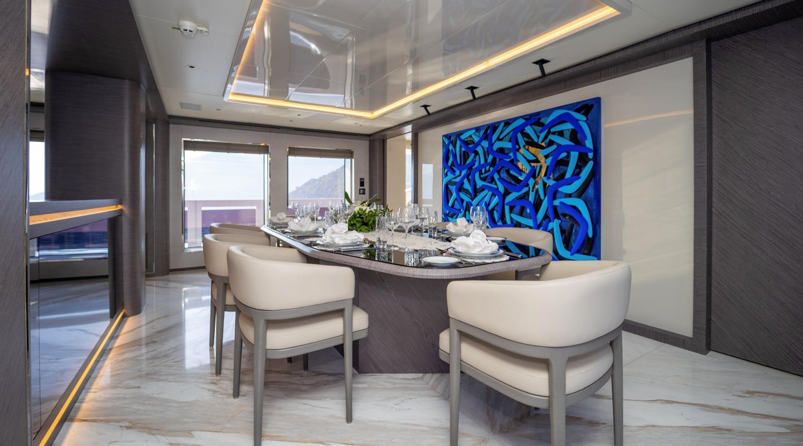 a dining table and chairs aboard M 47 Yacht for Sale