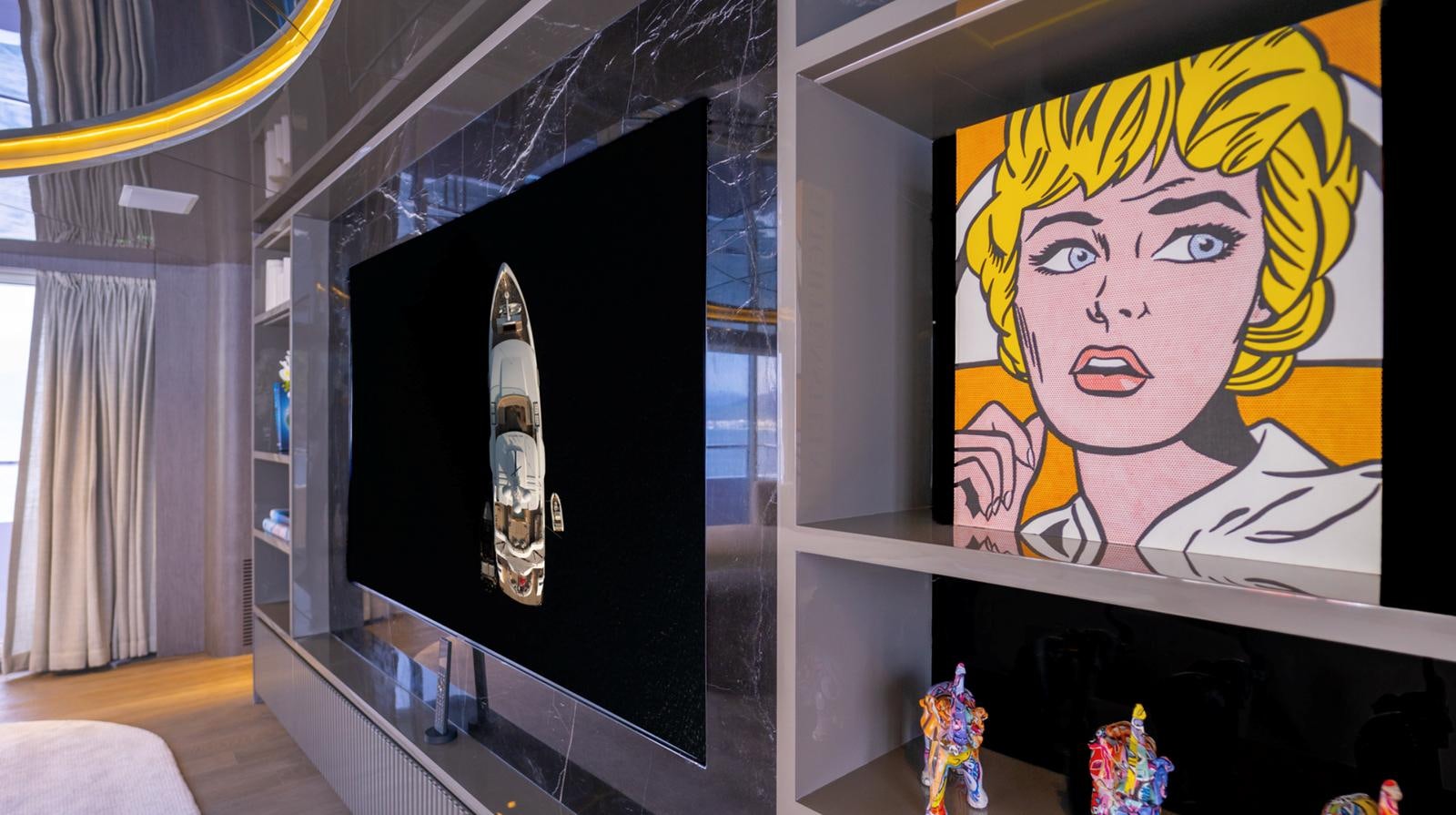 a display case with a painting on it aboard M 47 Yacht for Sale