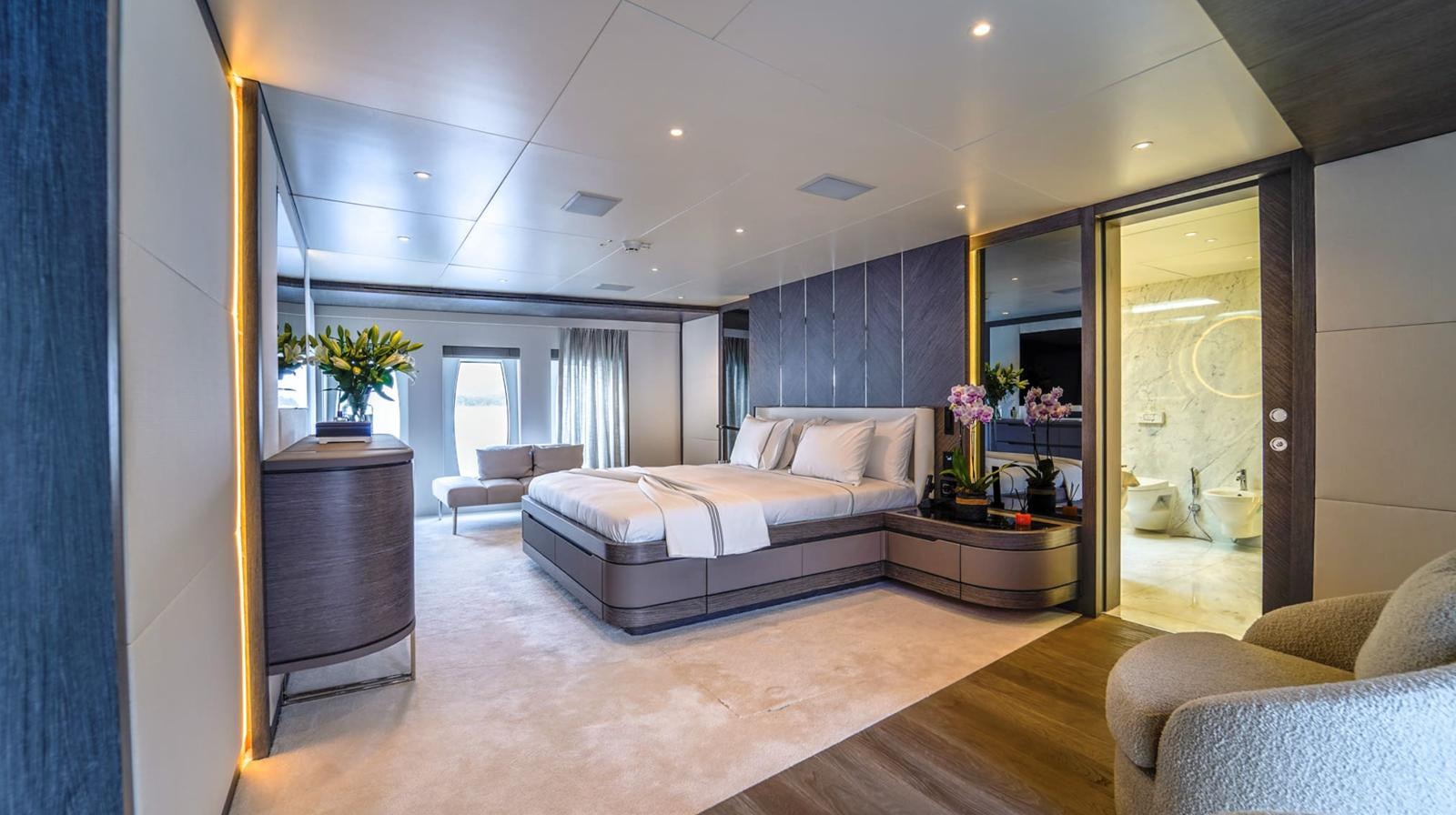 a living room with a large mirror aboard M 47 Yacht for Sale