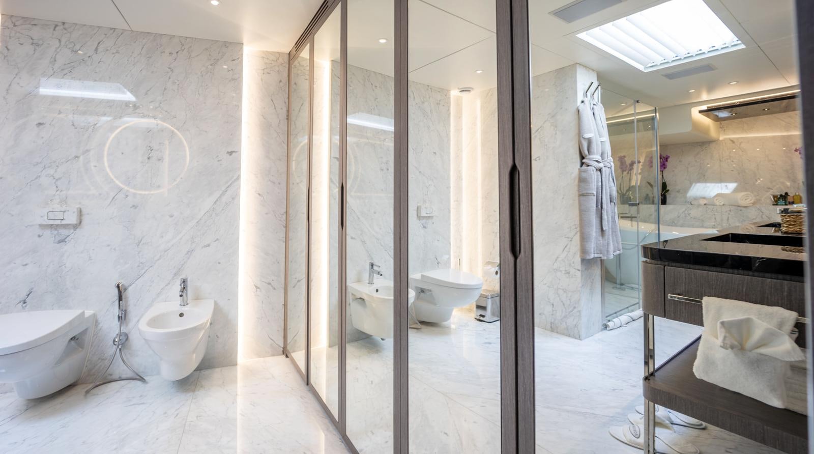 a bathroom with a glass shower aboard M 47 Yacht for Sale