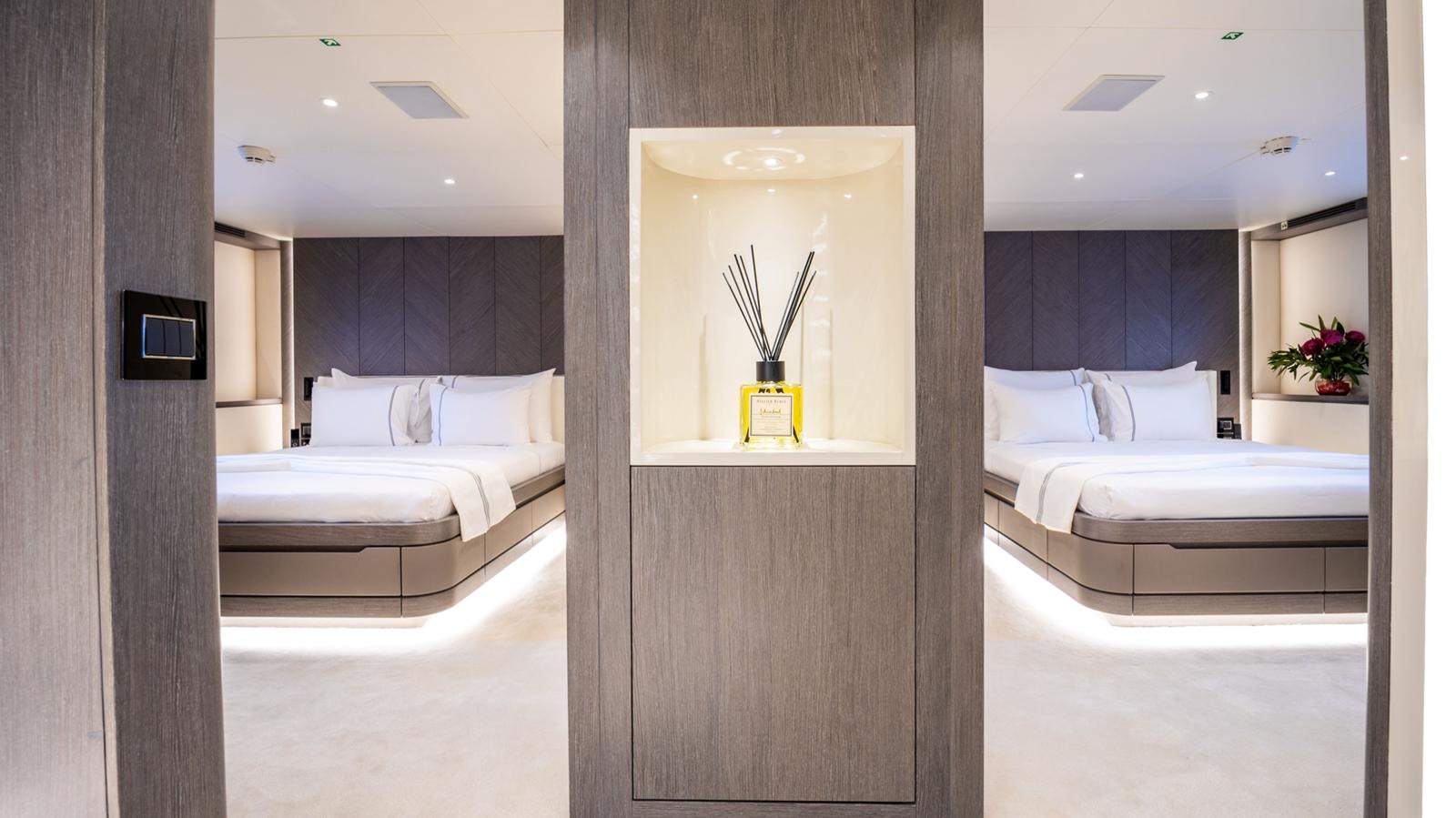 a room with a bed and a mirror aboard M 47 Yacht for Sale