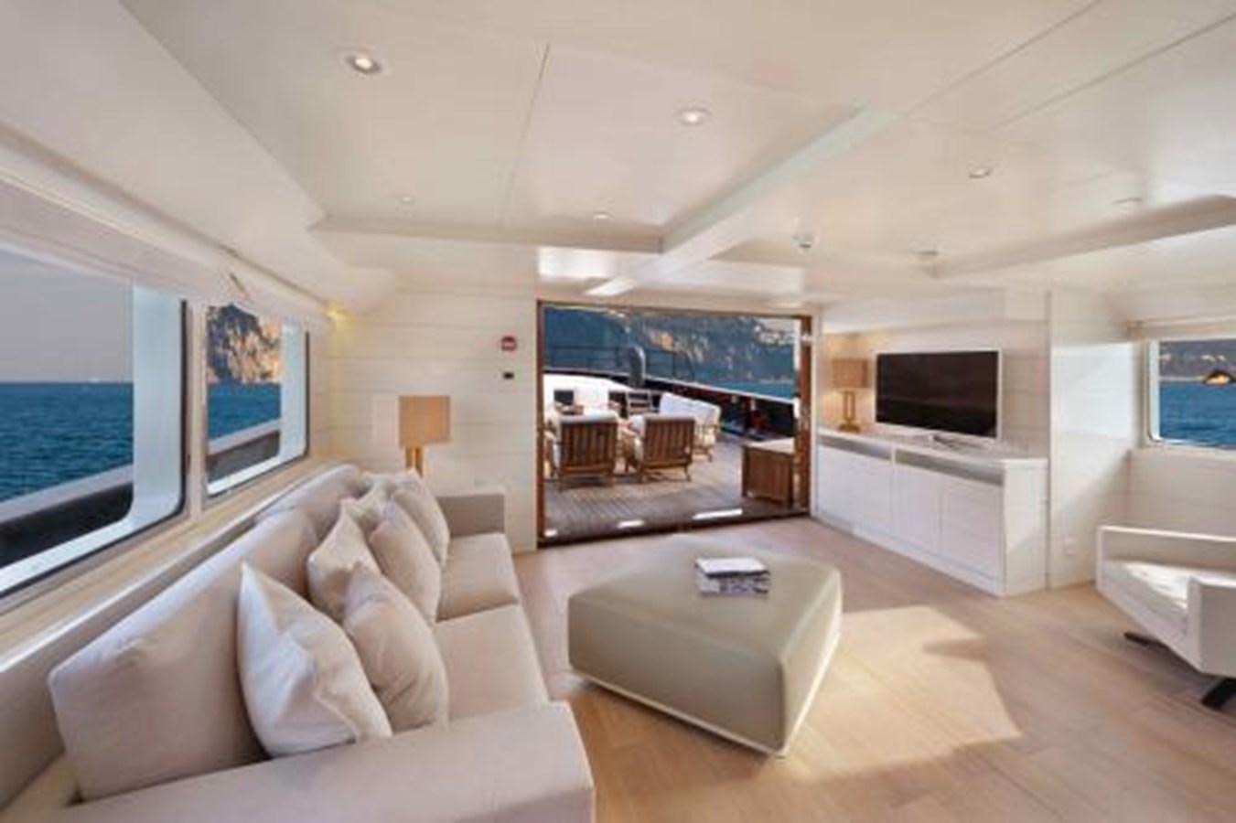 a living room with a large window aboard VERVECE Yacht for Sale