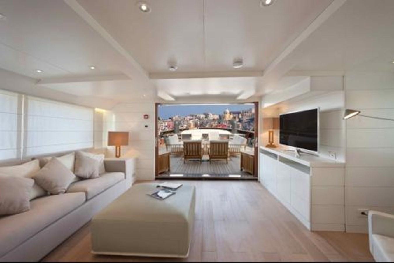 a living room with a large tv aboard VERVECE Yacht for Sale