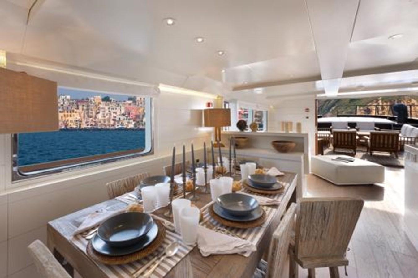 a large room with a table and chairs aboard VERVECE Yacht for Sale