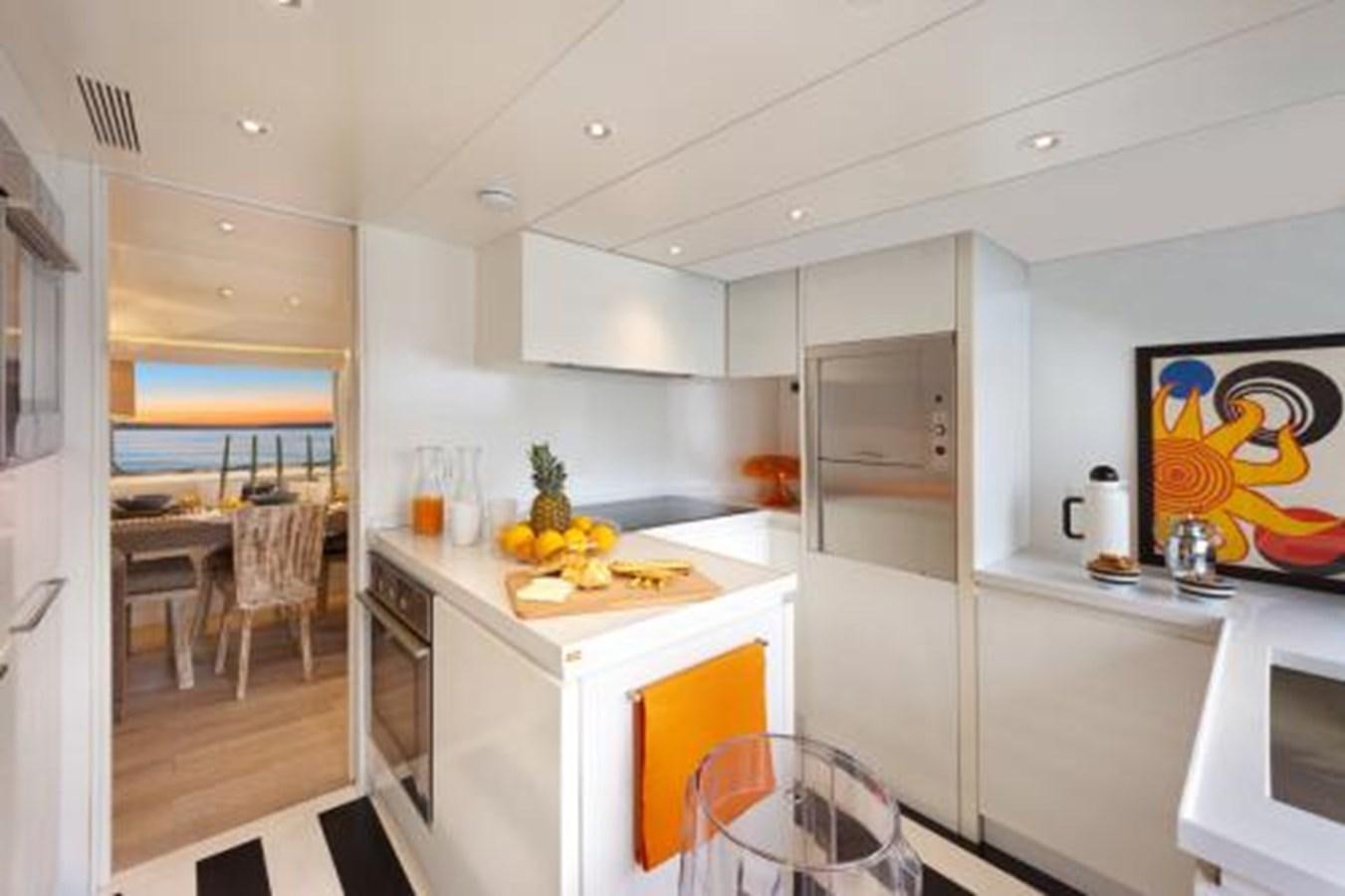 a kitchen with white cabinets aboard VERVECE Yacht for Sale