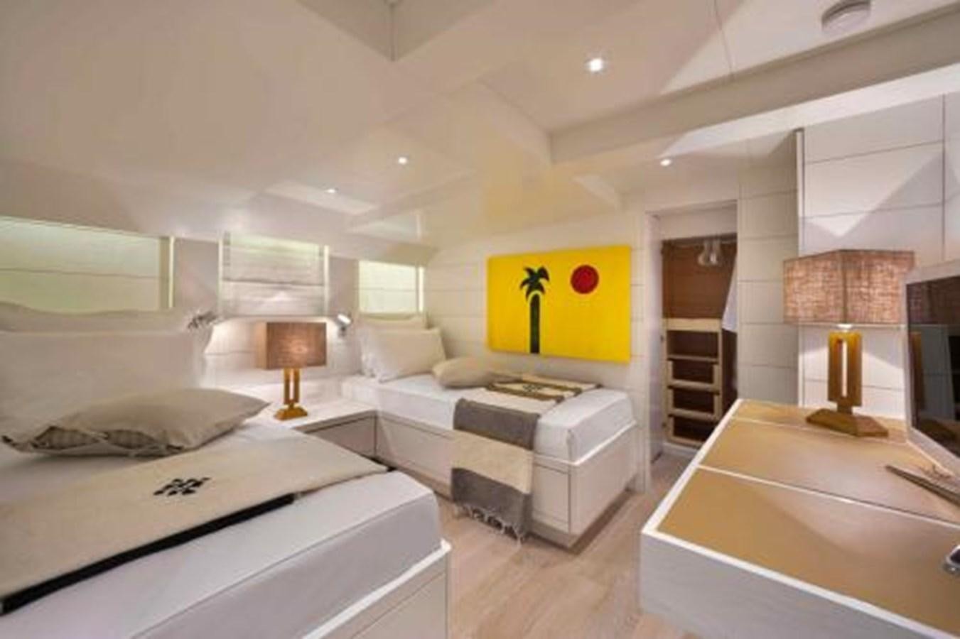 a room with a bed and a desk aboard VERVECE Yacht for Sale