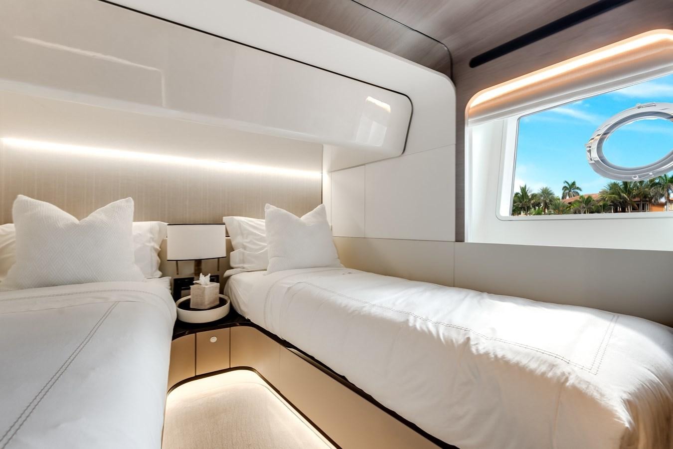 a room with a bed and a window aboard DAYBREAK Yacht for Sale