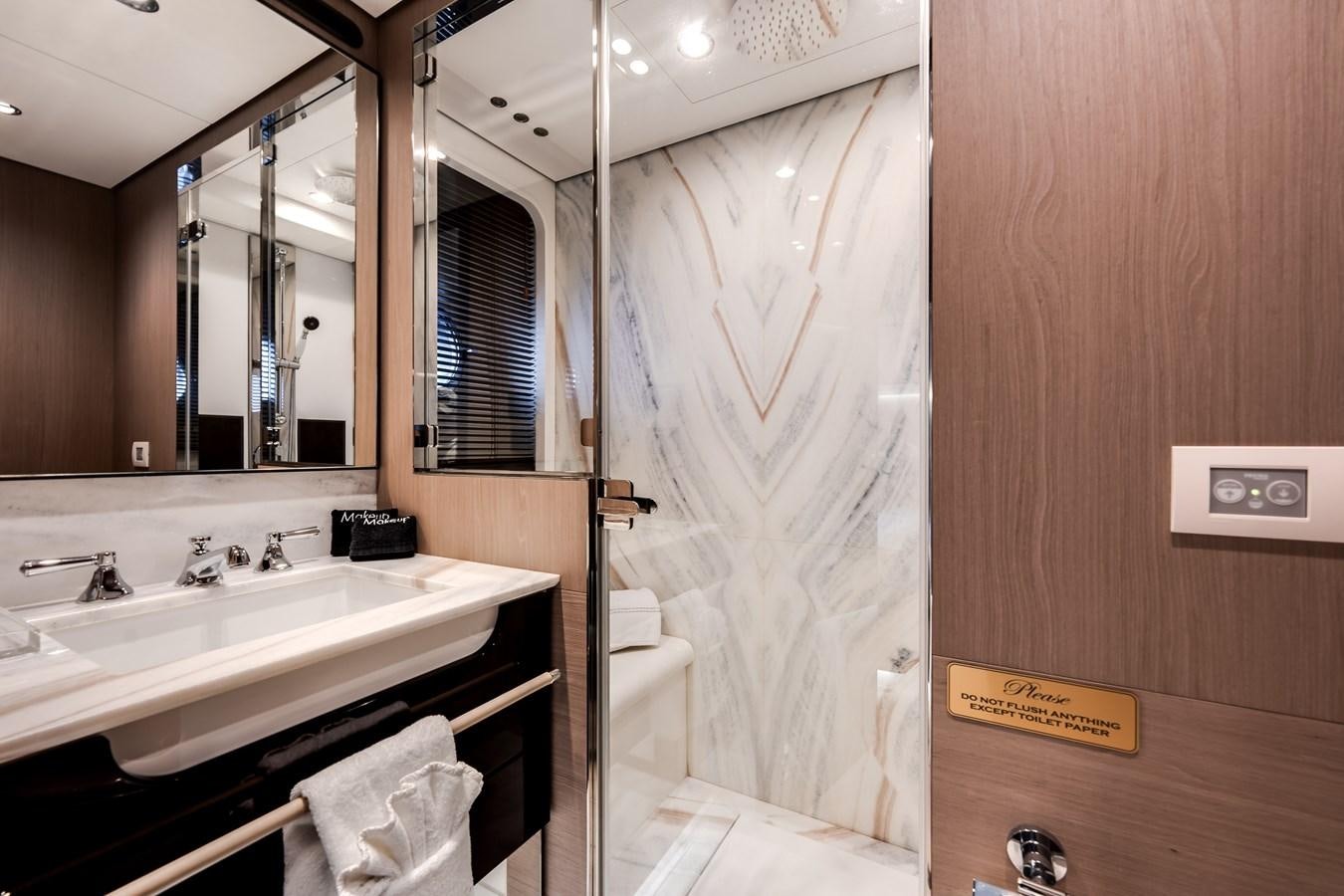 a bathroom with a sink and a bathtub aboard DAYBREAK Yacht for Sale