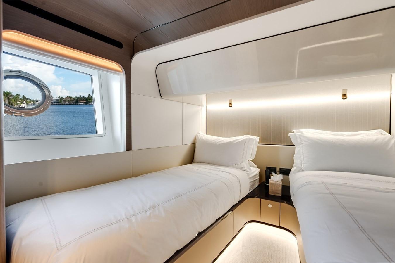 a room with two beds aboard DAYBREAK Yacht for Sale
