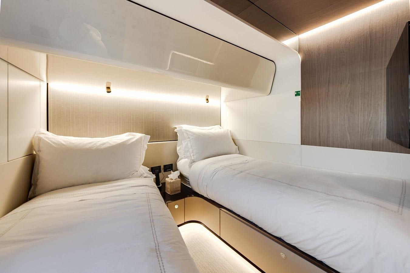a room with two beds aboard DAYBREAK Yacht for Sale