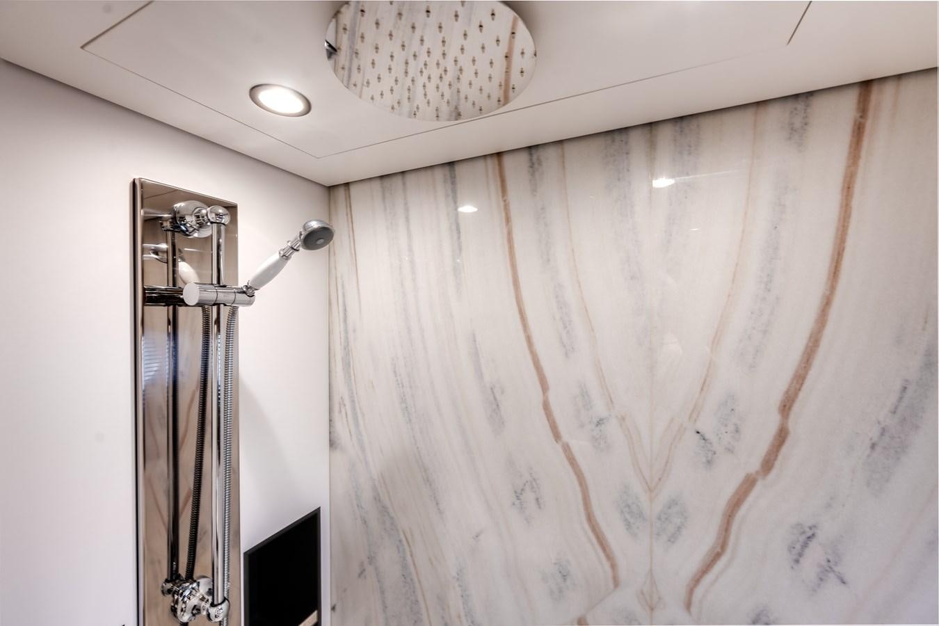 a shower curtain and a sink aboard DAYBREAK Yacht for Sale