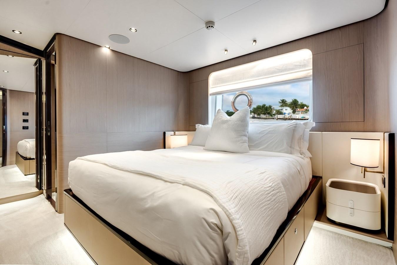 a room with a bed and a window aboard DAYBREAK Yacht for Sale
