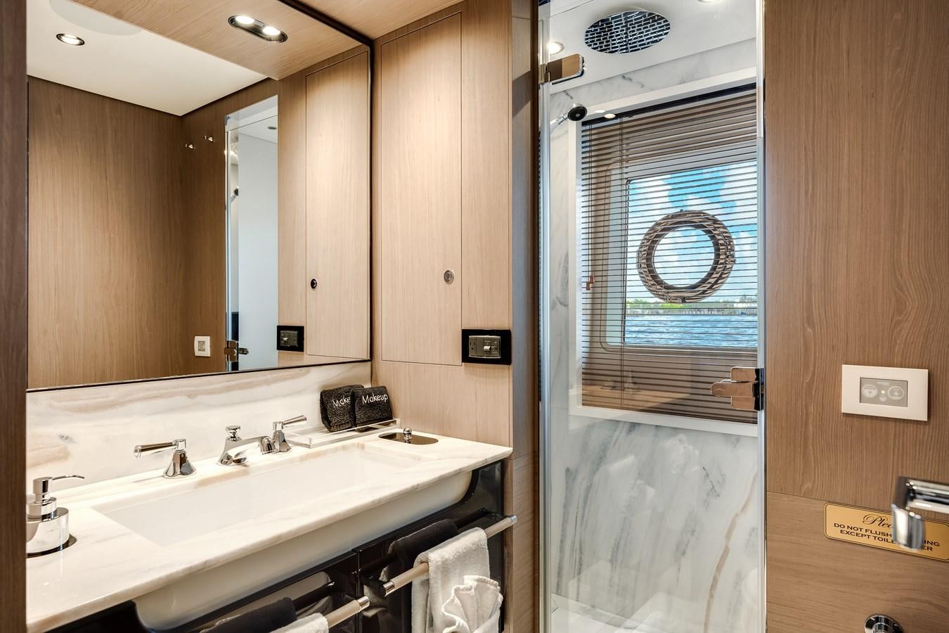 a bathroom with a sink and a mirror aboard DAYBREAK Yacht for Sale