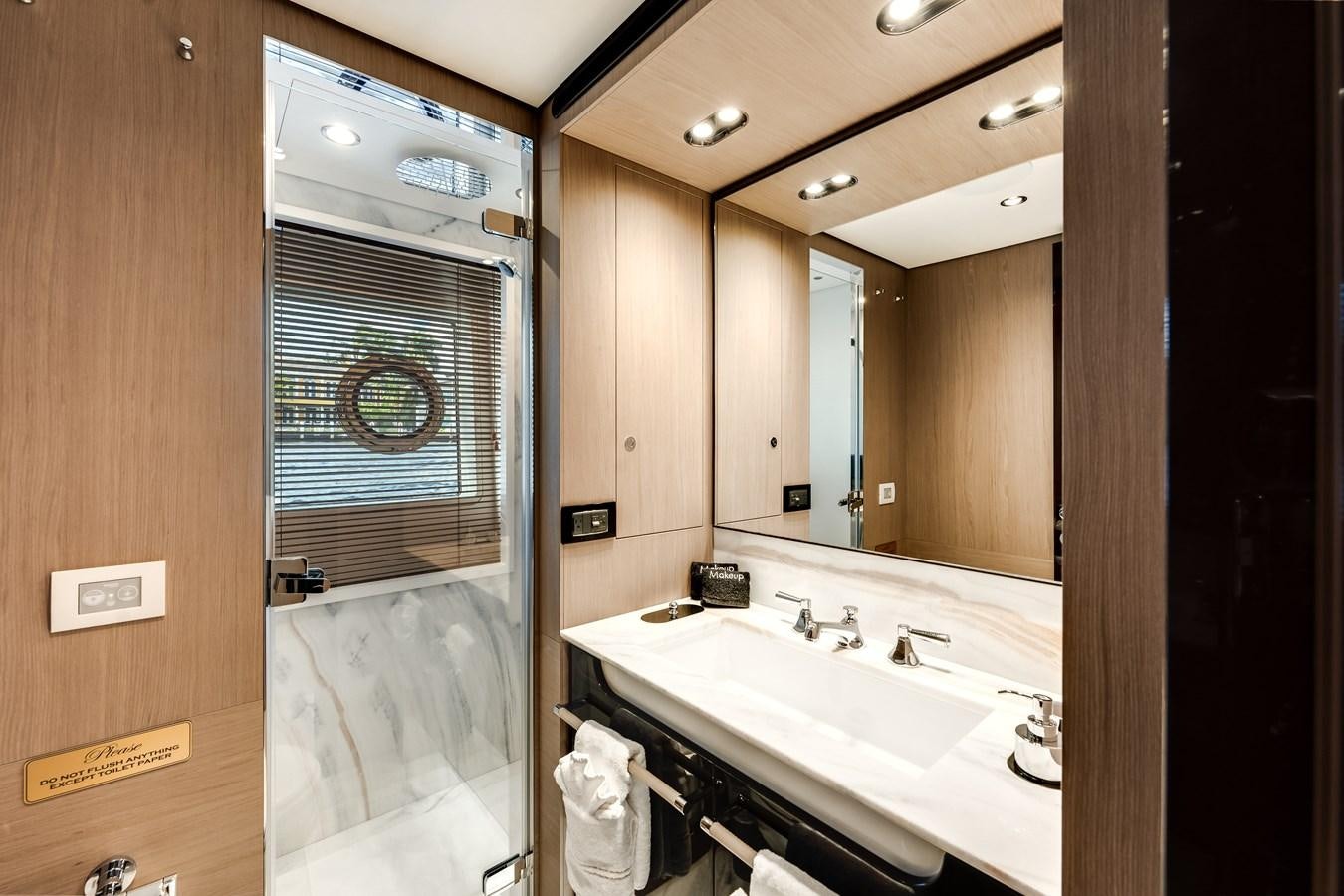 a bathroom with a large mirror aboard DAYBREAK Yacht for Sale