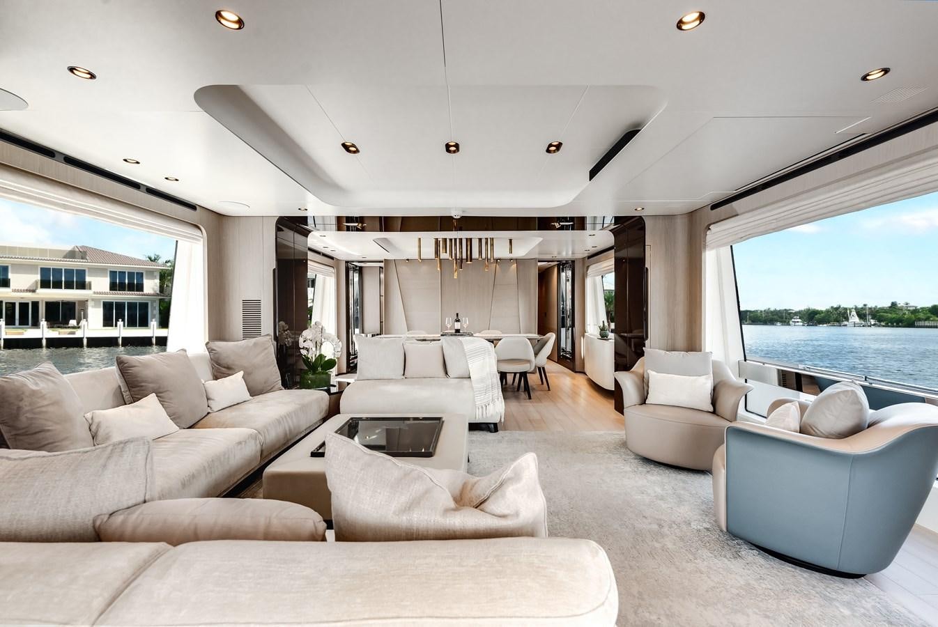 a living room with a large window aboard DAYBREAK Yacht for Sale