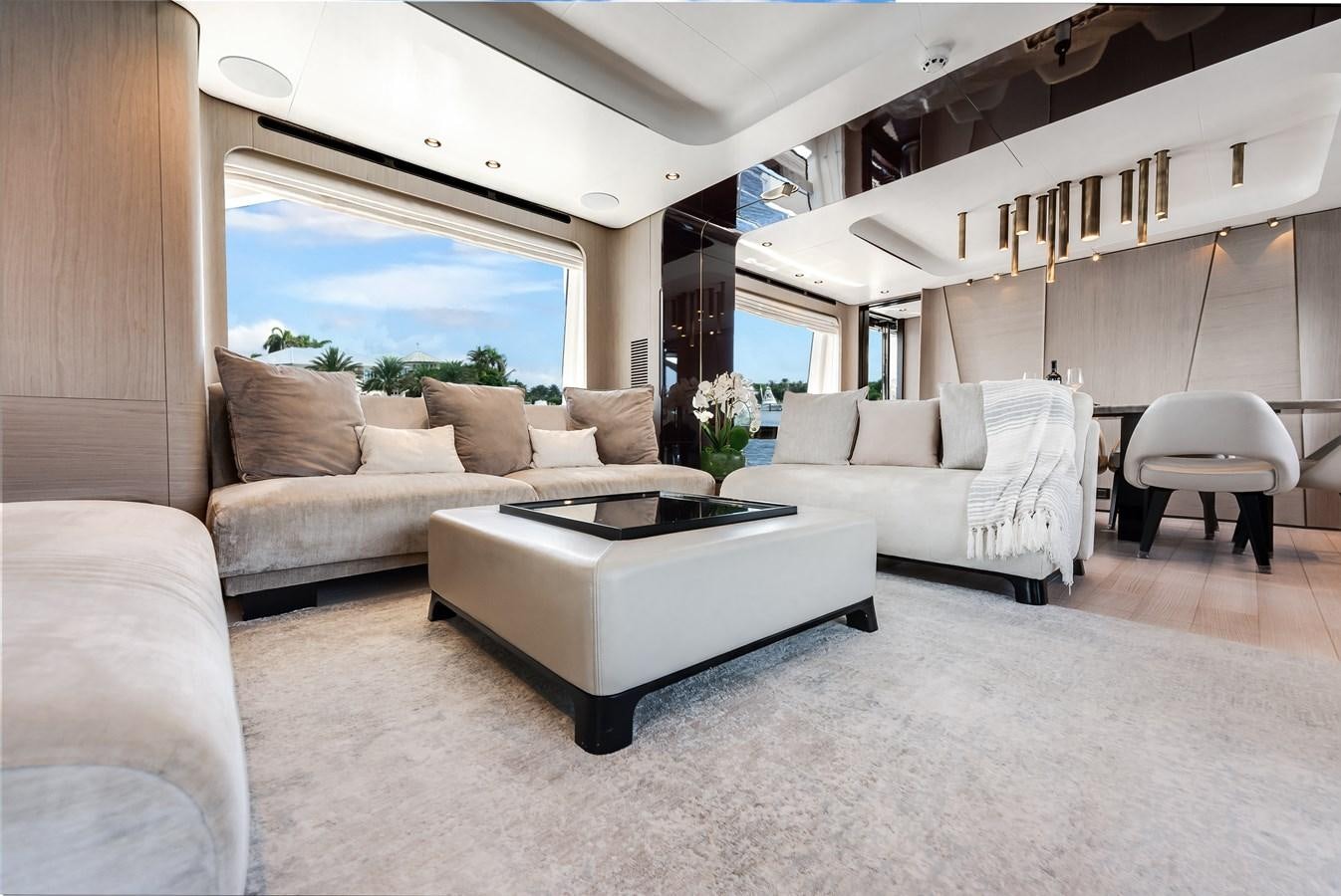 a living room with a couch and a table aboard DAYBREAK Yacht for Sale