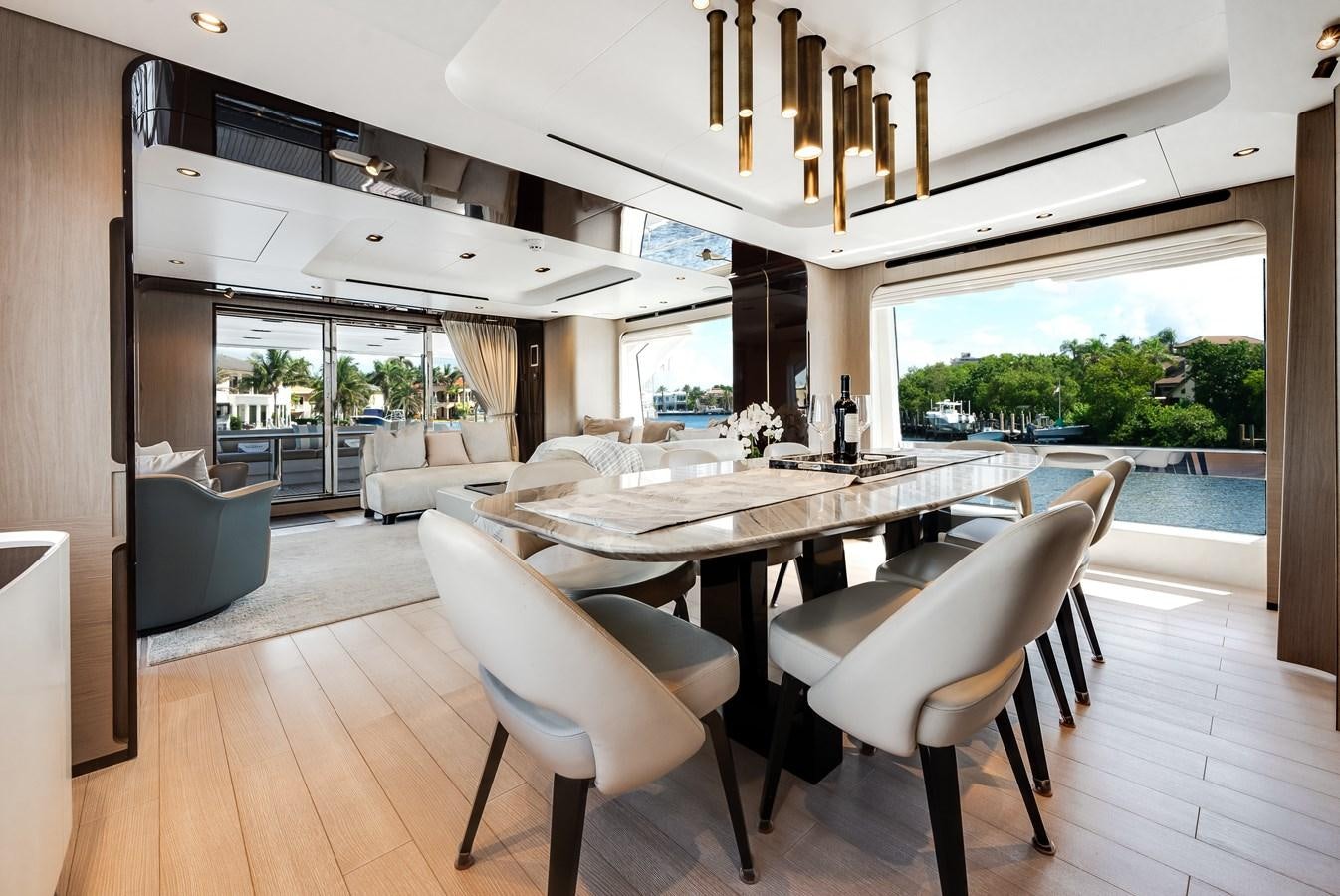 a large dining table in a room aboard DAYBREAK Yacht for Sale