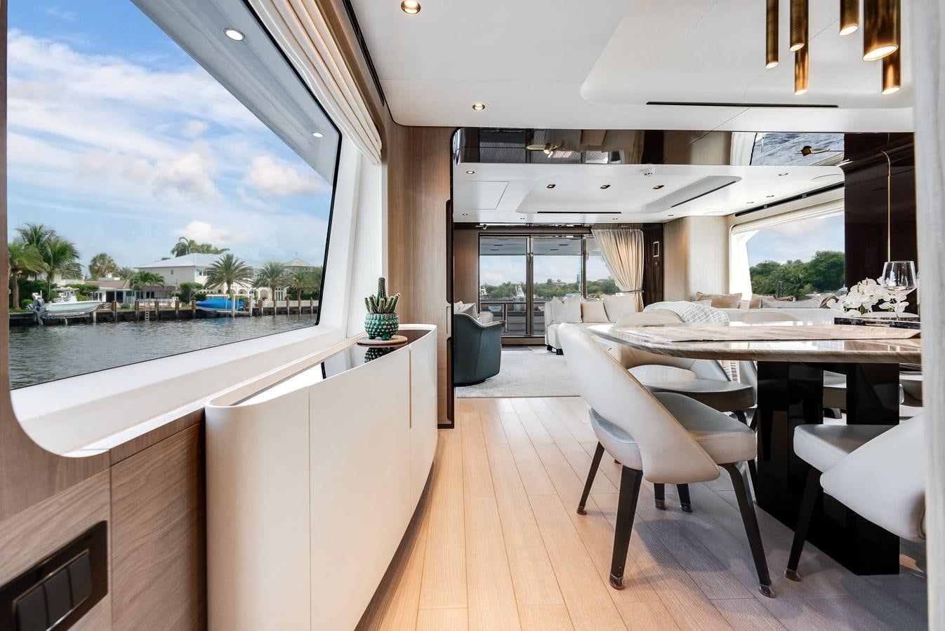 a room with a table and chairs aboard DAYBREAK Yacht for Sale