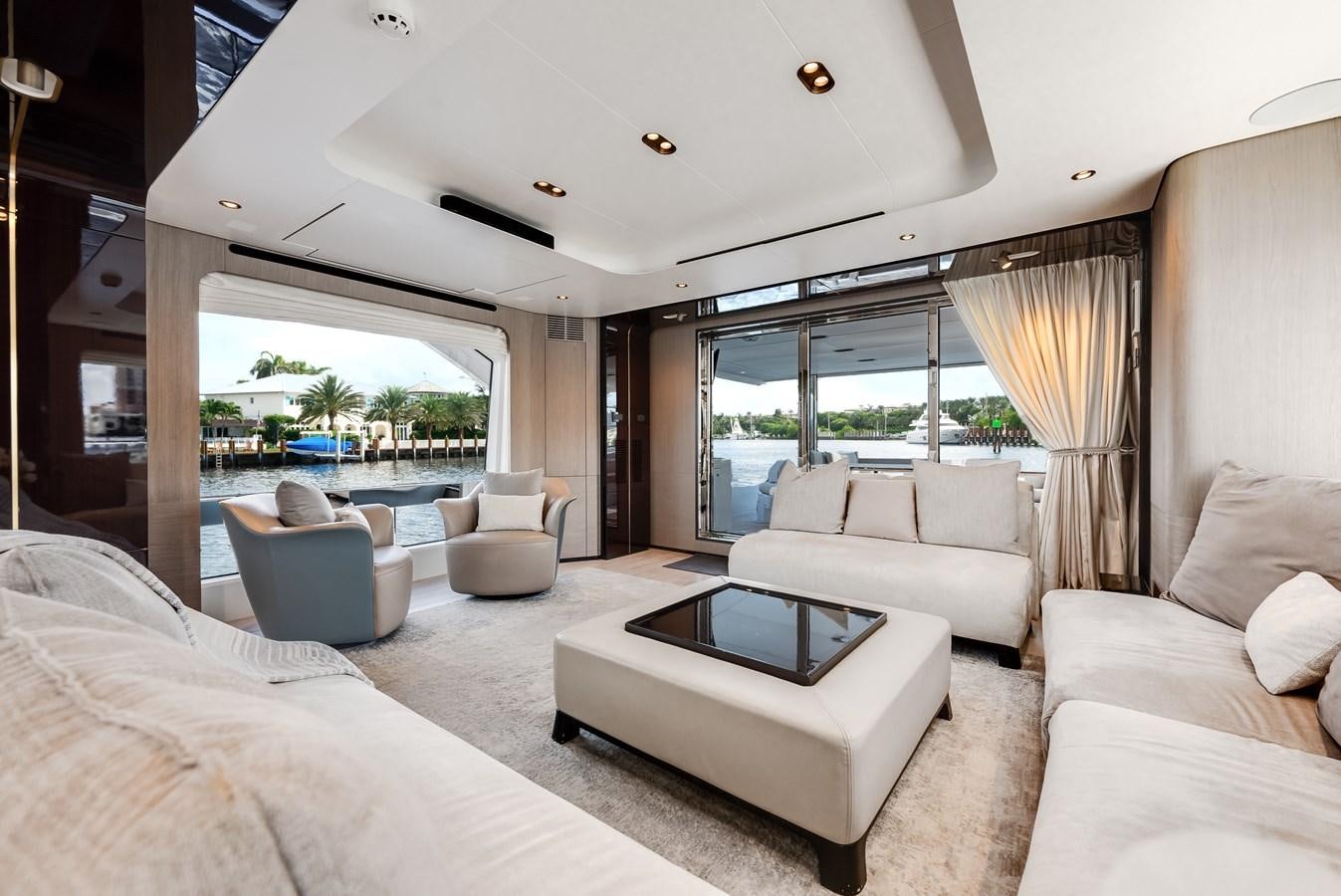 a living room with a large window aboard DAYBREAK Yacht for Sale