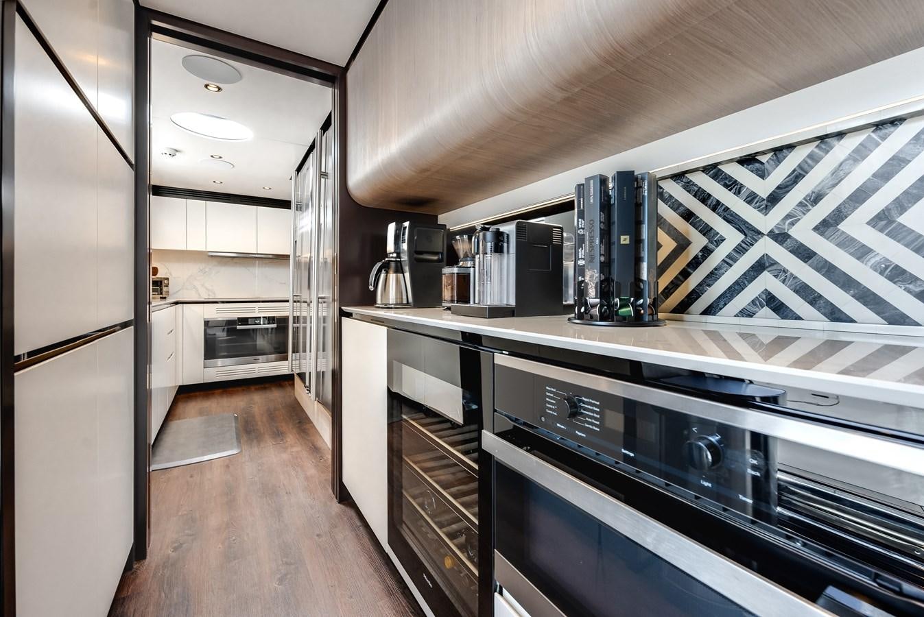 a kitchen with a large island aboard DAYBREAK Yacht for Sale