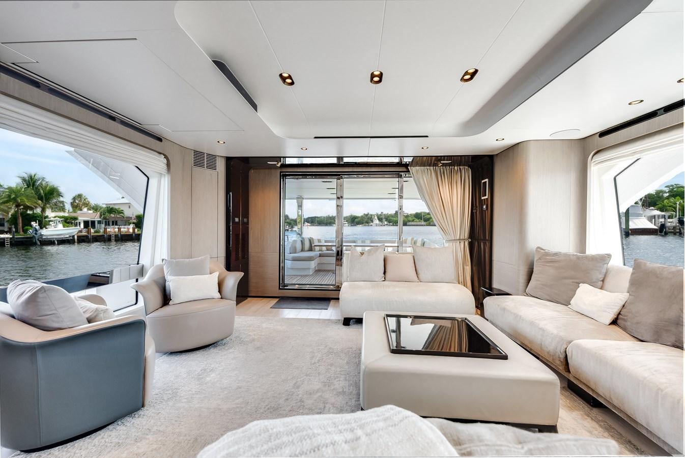 a living room with a large window aboard DAYBREAK Yacht for Sale