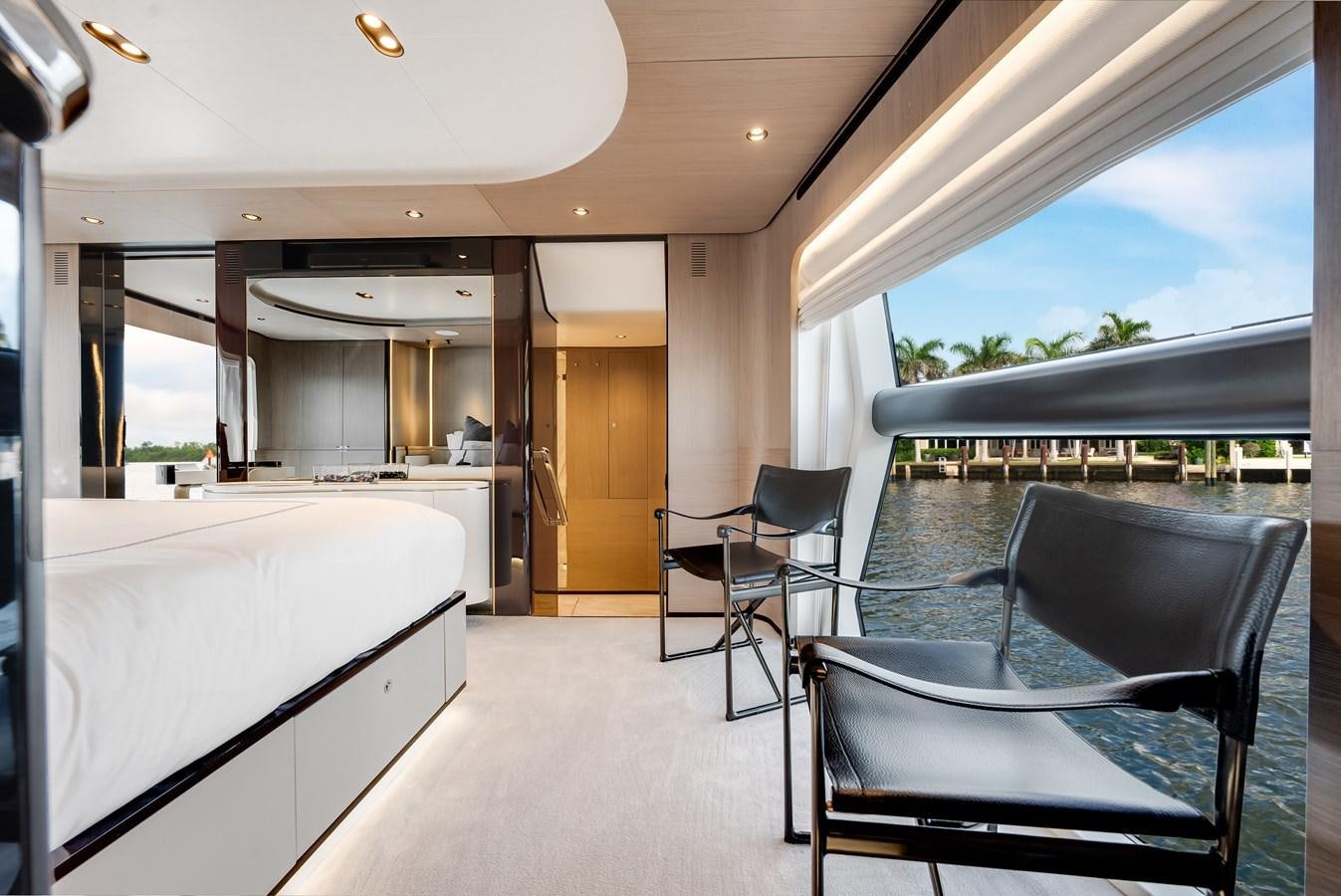 a room with a table chairs and a bed aboard DAYBREAK Yacht for Sale