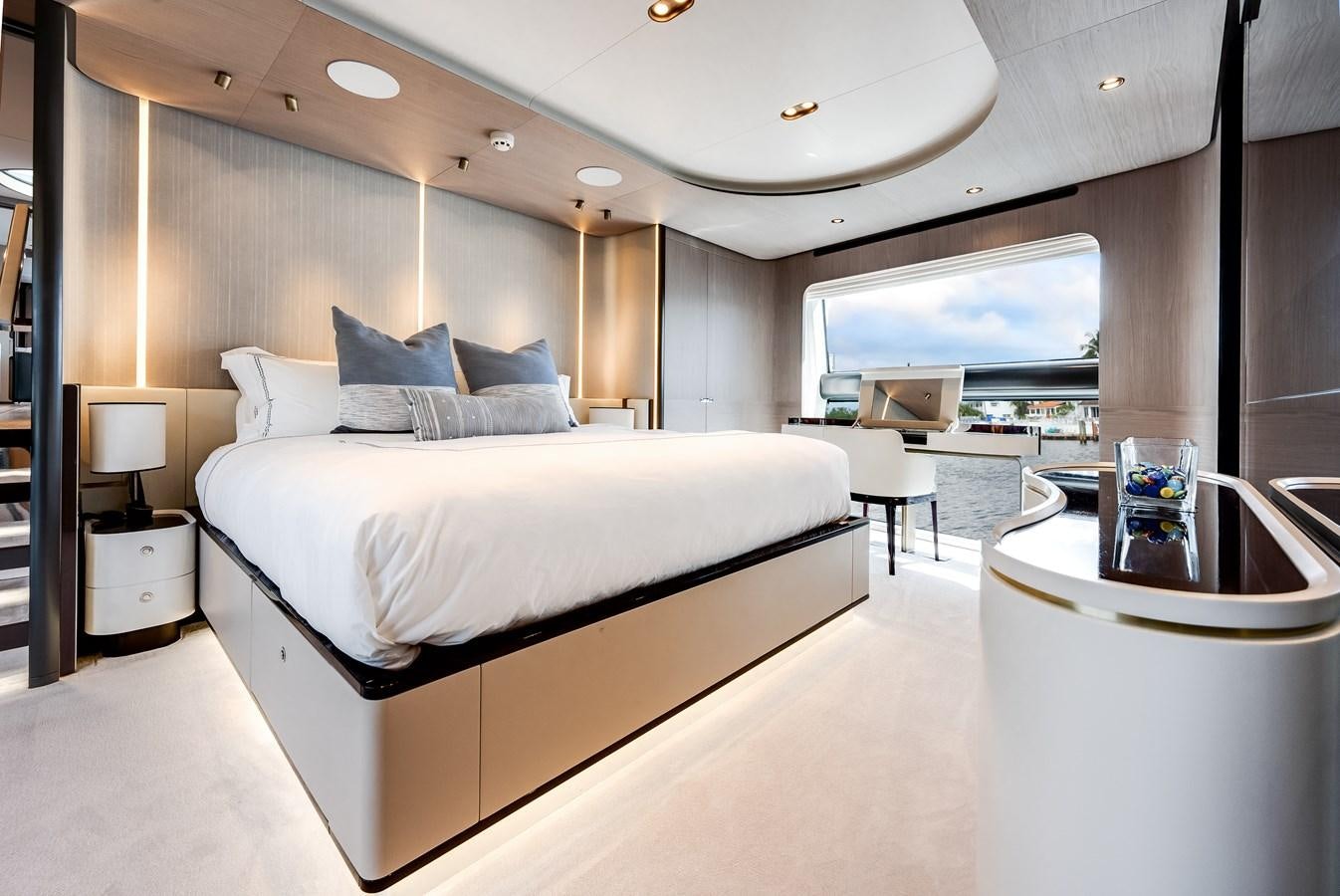 a modern bedroom with a large bed aboard DAYBREAK Yacht for Sale