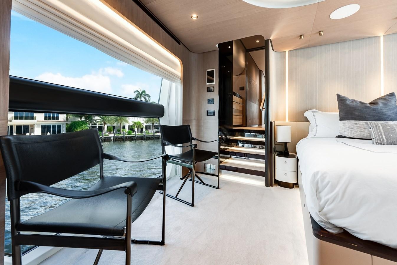 a room with a bed and a chair aboard DAYBREAK Yacht for Sale