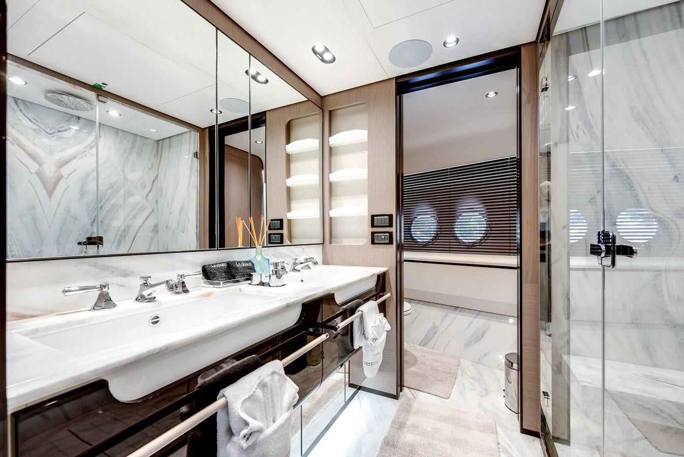 a bathroom with a large mirror aboard DAYBREAK Yacht for Sale