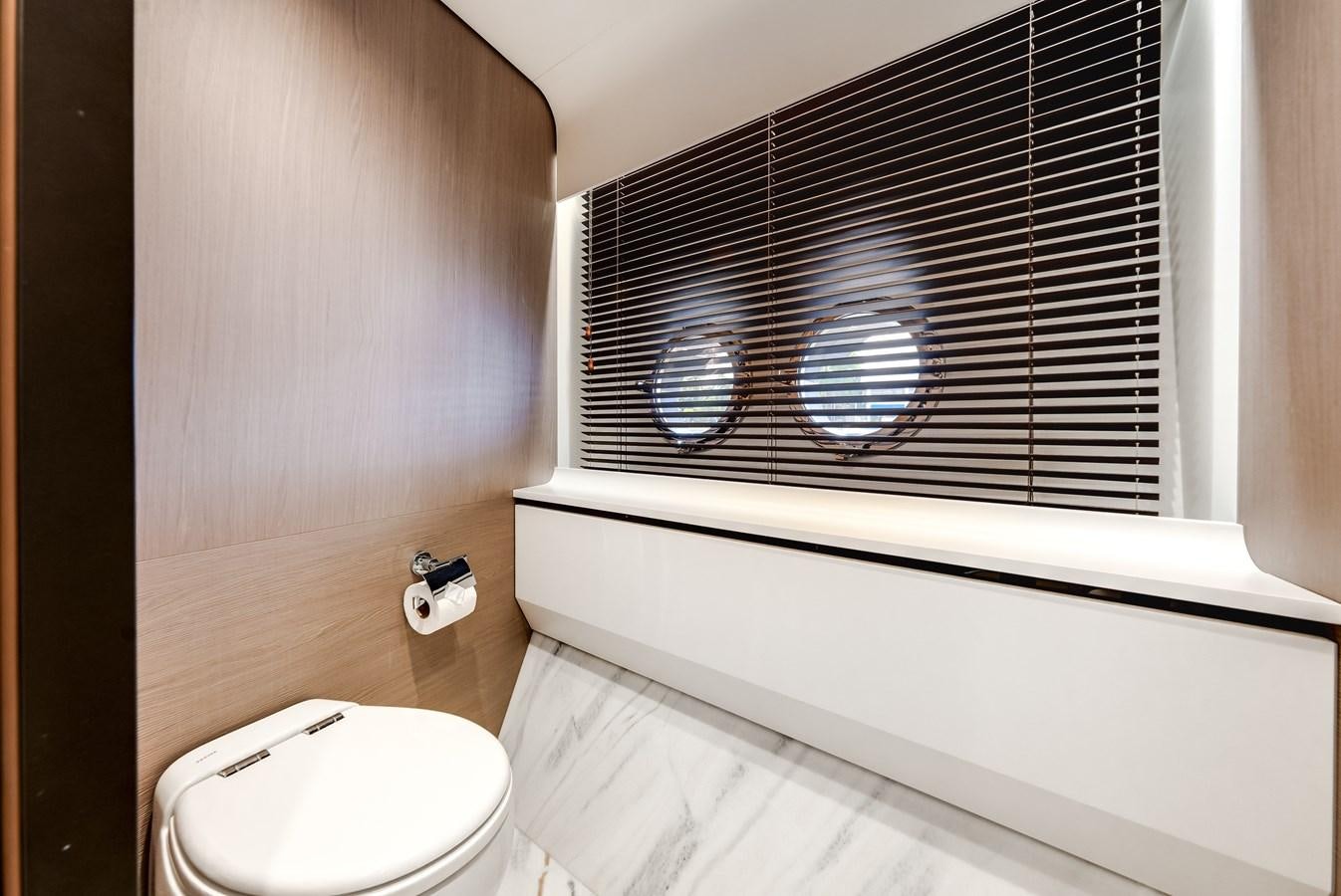 a bathroom with a window aboard DAYBREAK Yacht for Sale