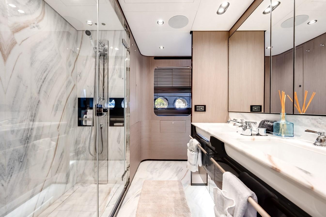 a bathroom with a shower and sink aboard DAYBREAK Yacht for Sale
