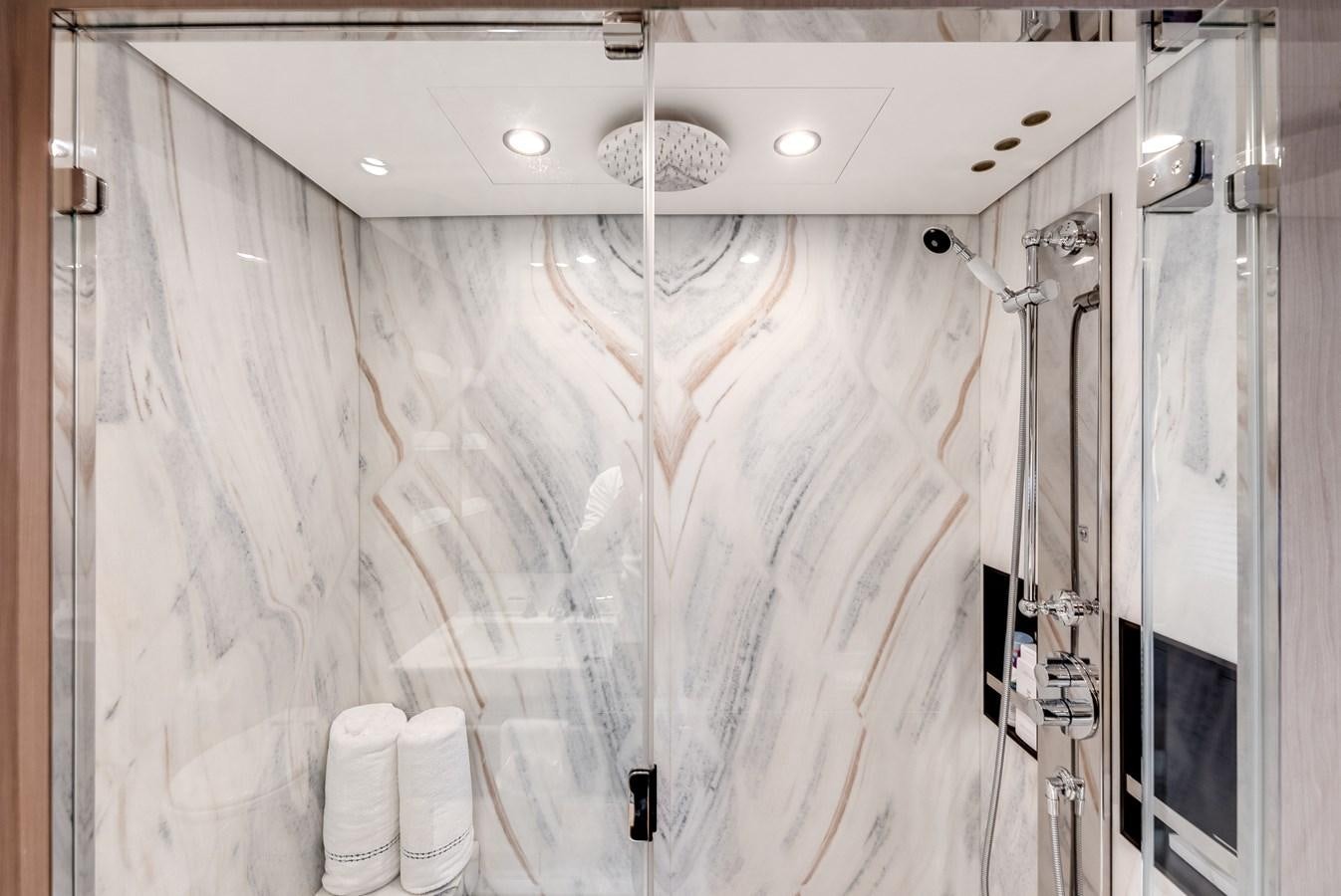 a shower with a glass wall aboard DAYBREAK Yacht for Sale