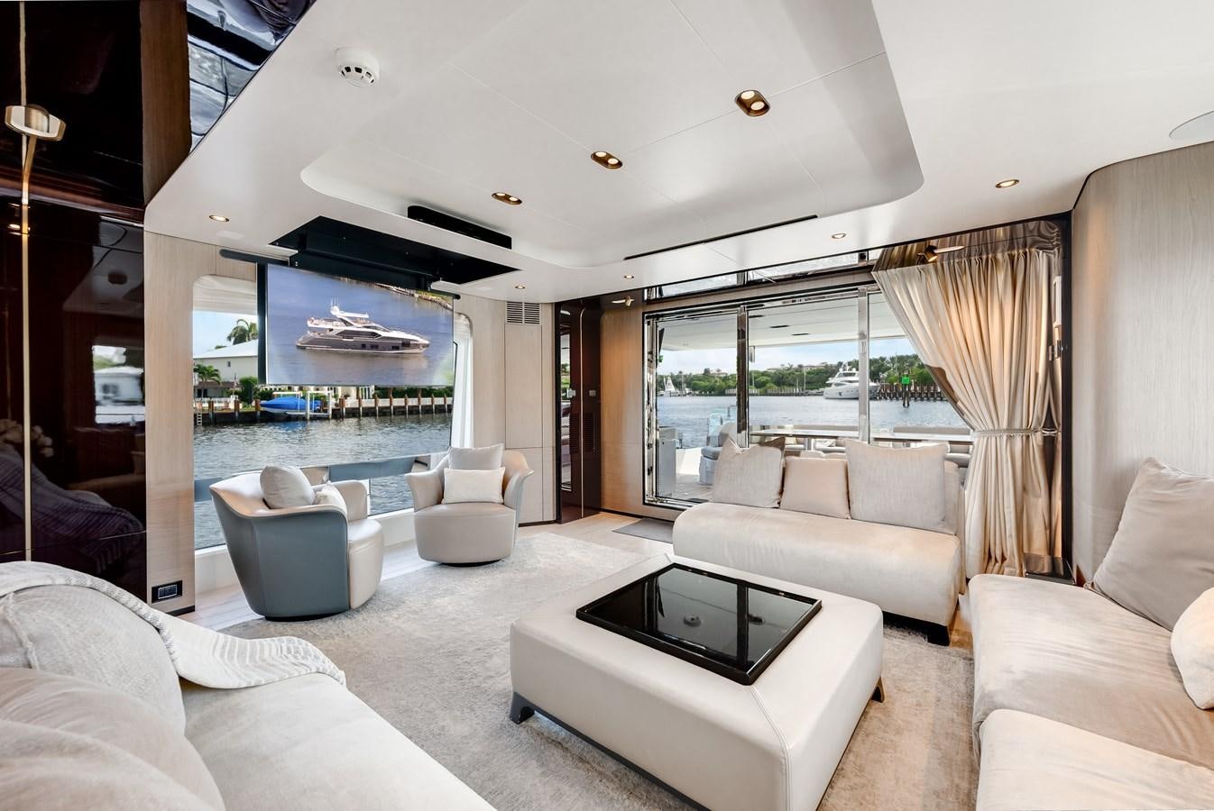 a living room with a large window aboard DAYBREAK Yacht for Sale