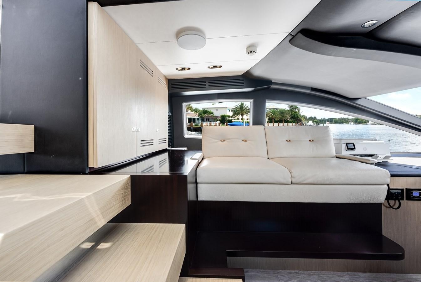 a white couch in a room aboard DAYBREAK Yacht for Sale
