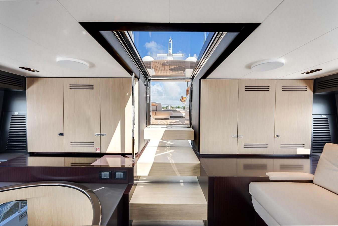 a room with a couch and a door aboard DAYBREAK Yacht for Sale