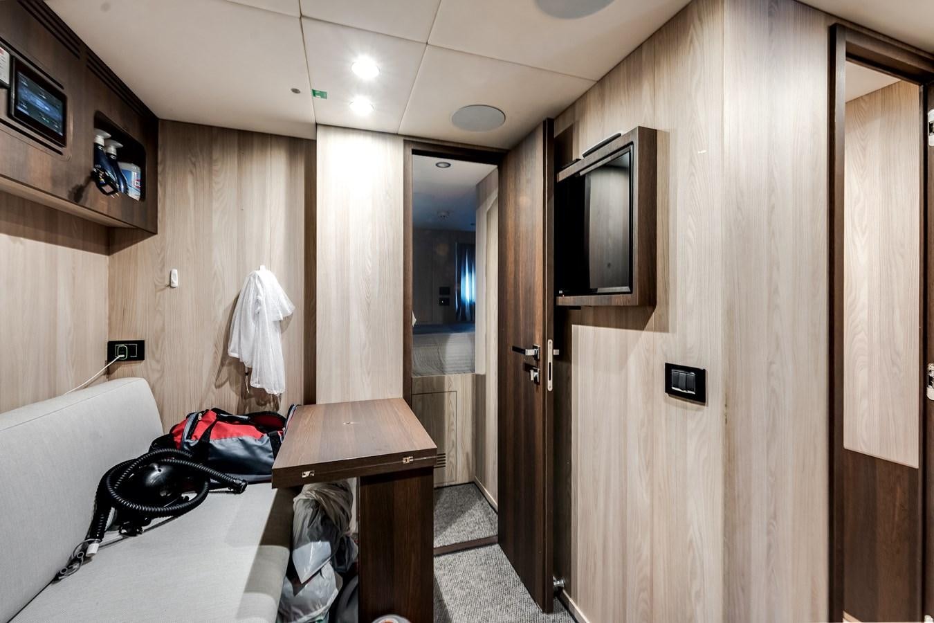 a room with a bed and television aboard DAYBREAK Yacht for Sale