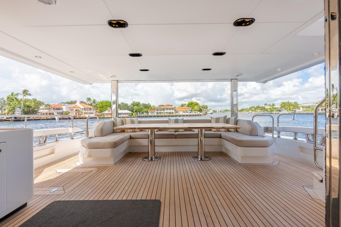 a room with a table and chairs aboard DAYBREAK Yacht for Sale