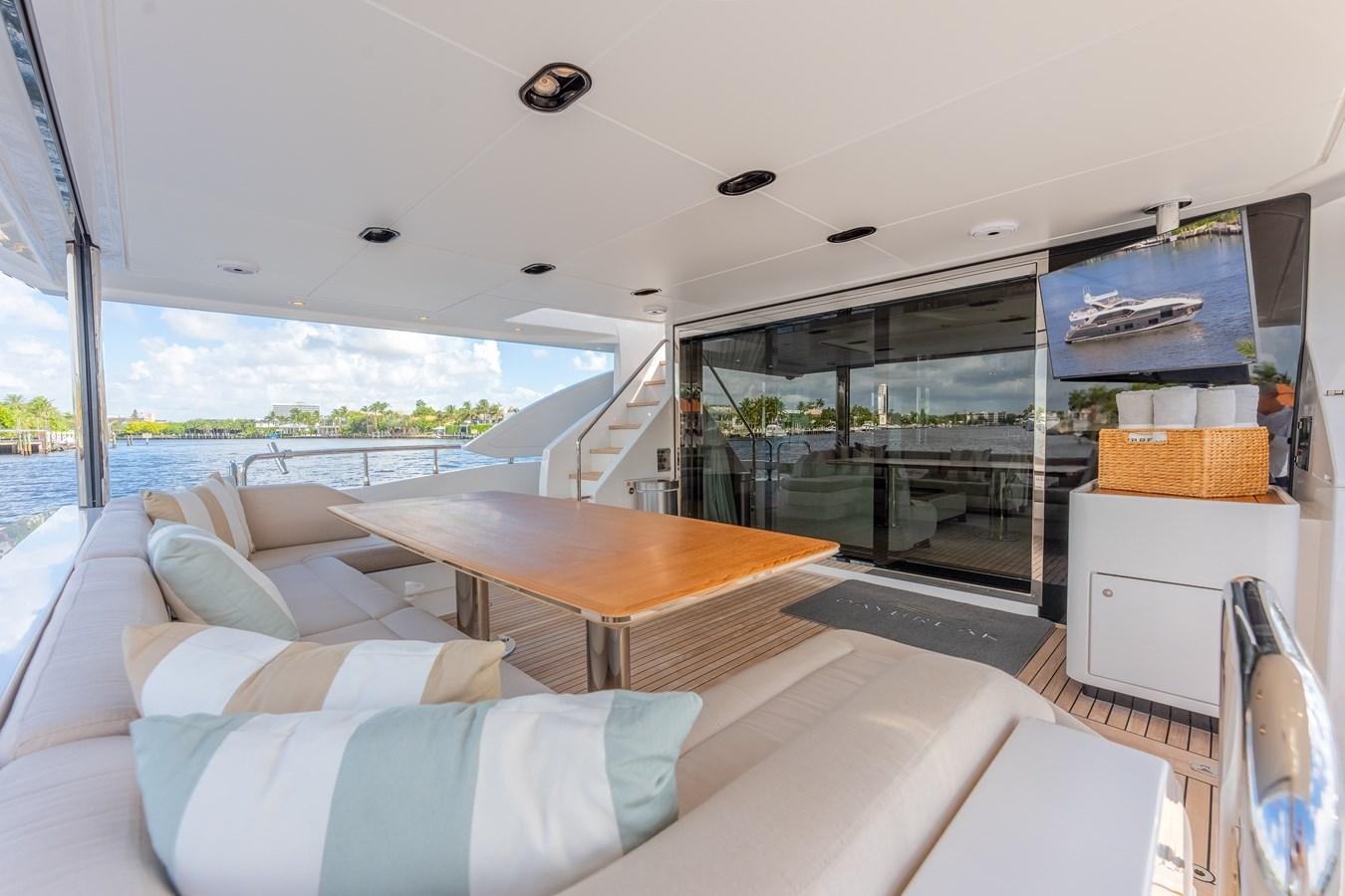a living room with a large window aboard DAYBREAK Yacht for Sale