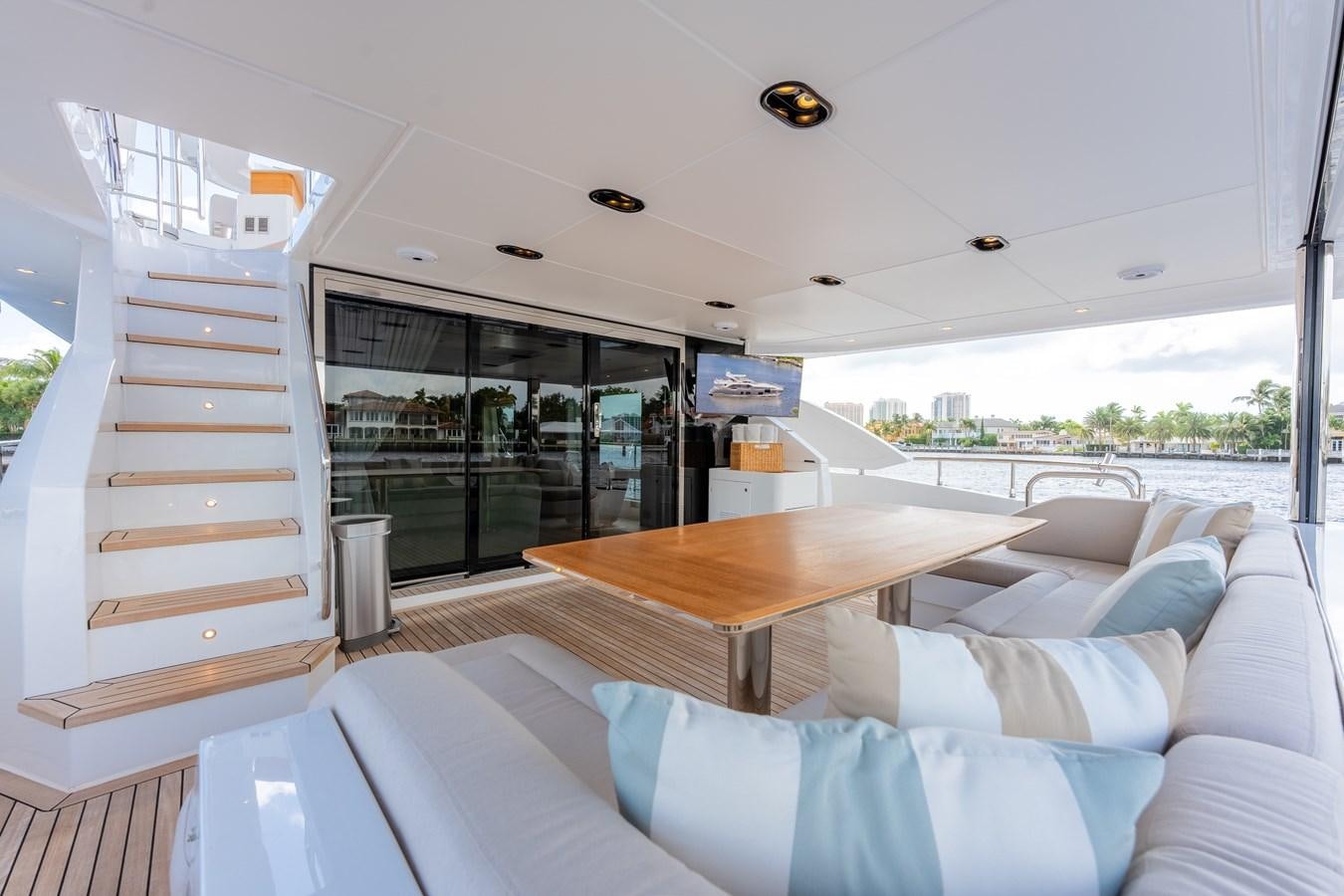a room with a couch and a table aboard DAYBREAK Yacht for Sale