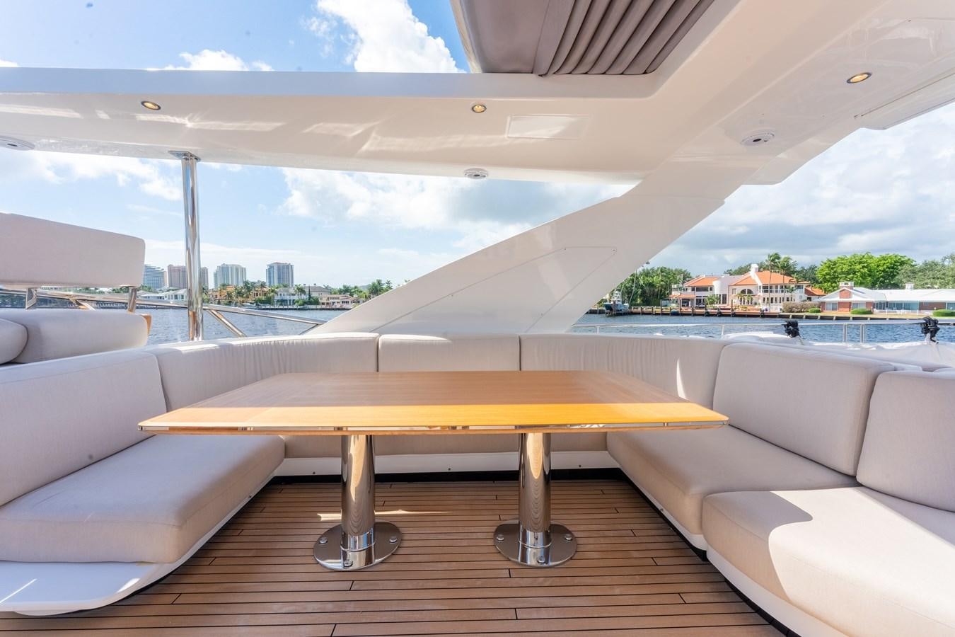 a table and couch in a room aboard DAYBREAK Yacht for Sale