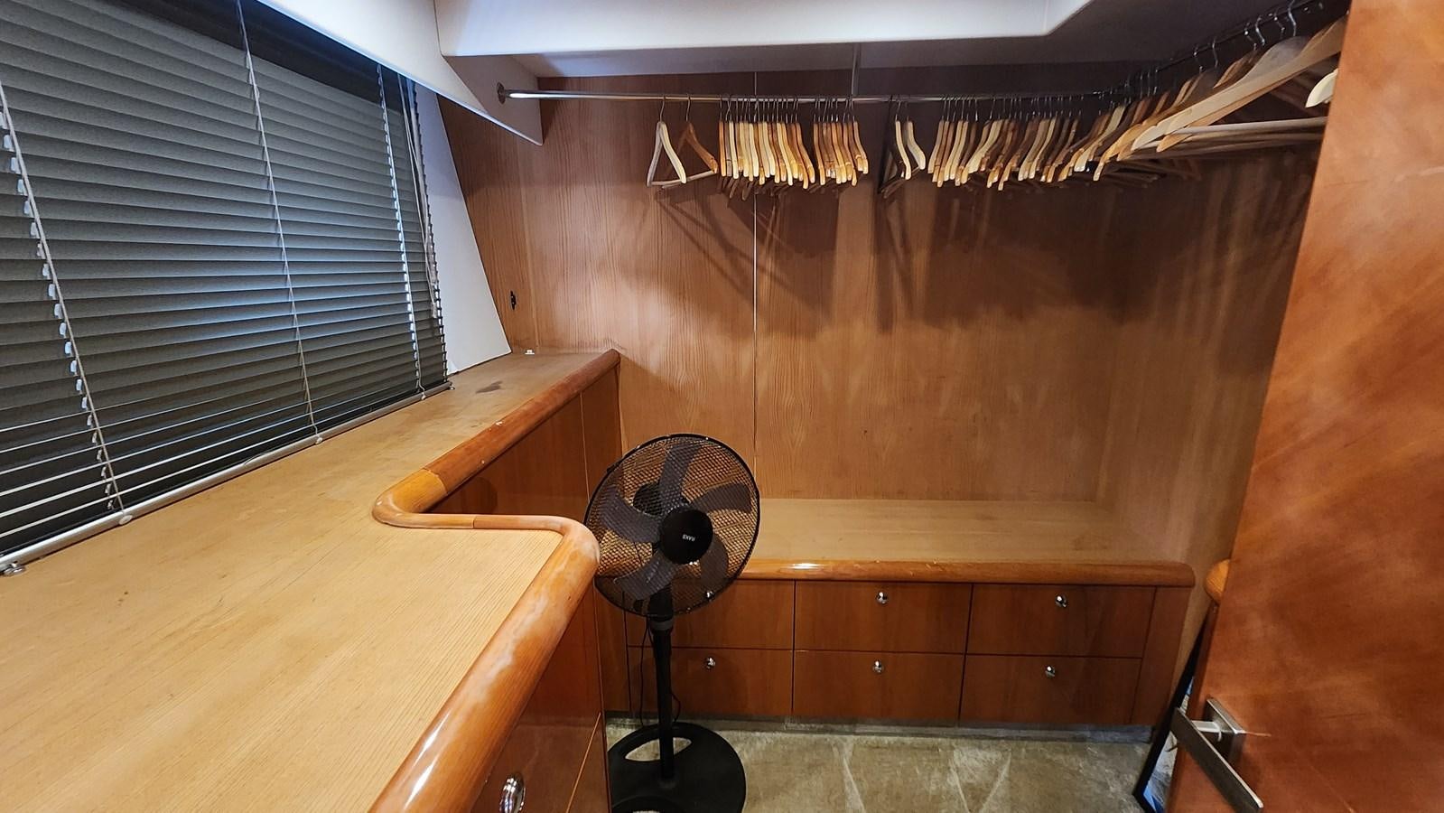 a fan on a wooden table aboard SPACE ODDITY Yacht for Sale