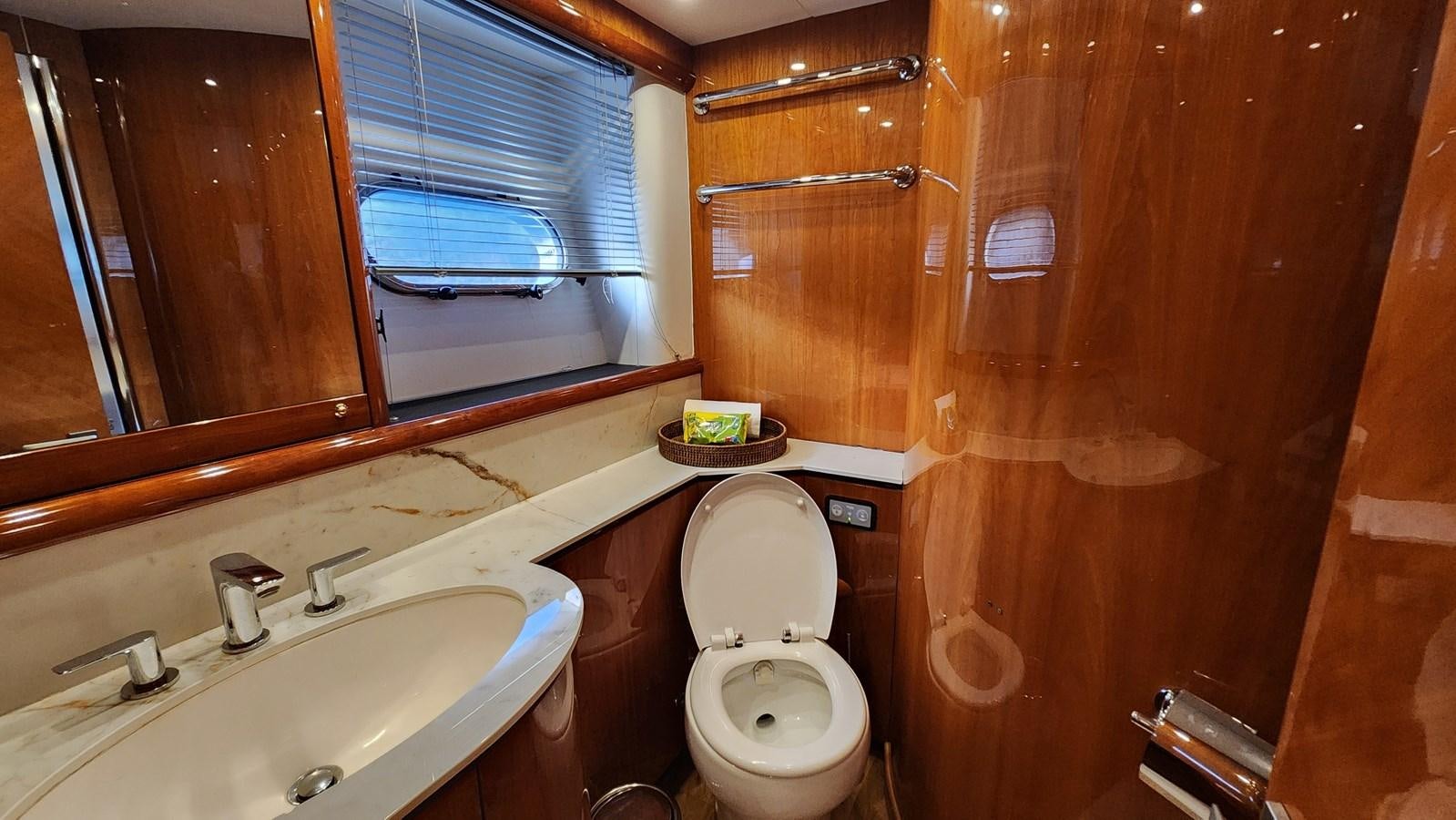a bathroom with a toilet and sink aboard SPACE ODDITY Yacht for Sale