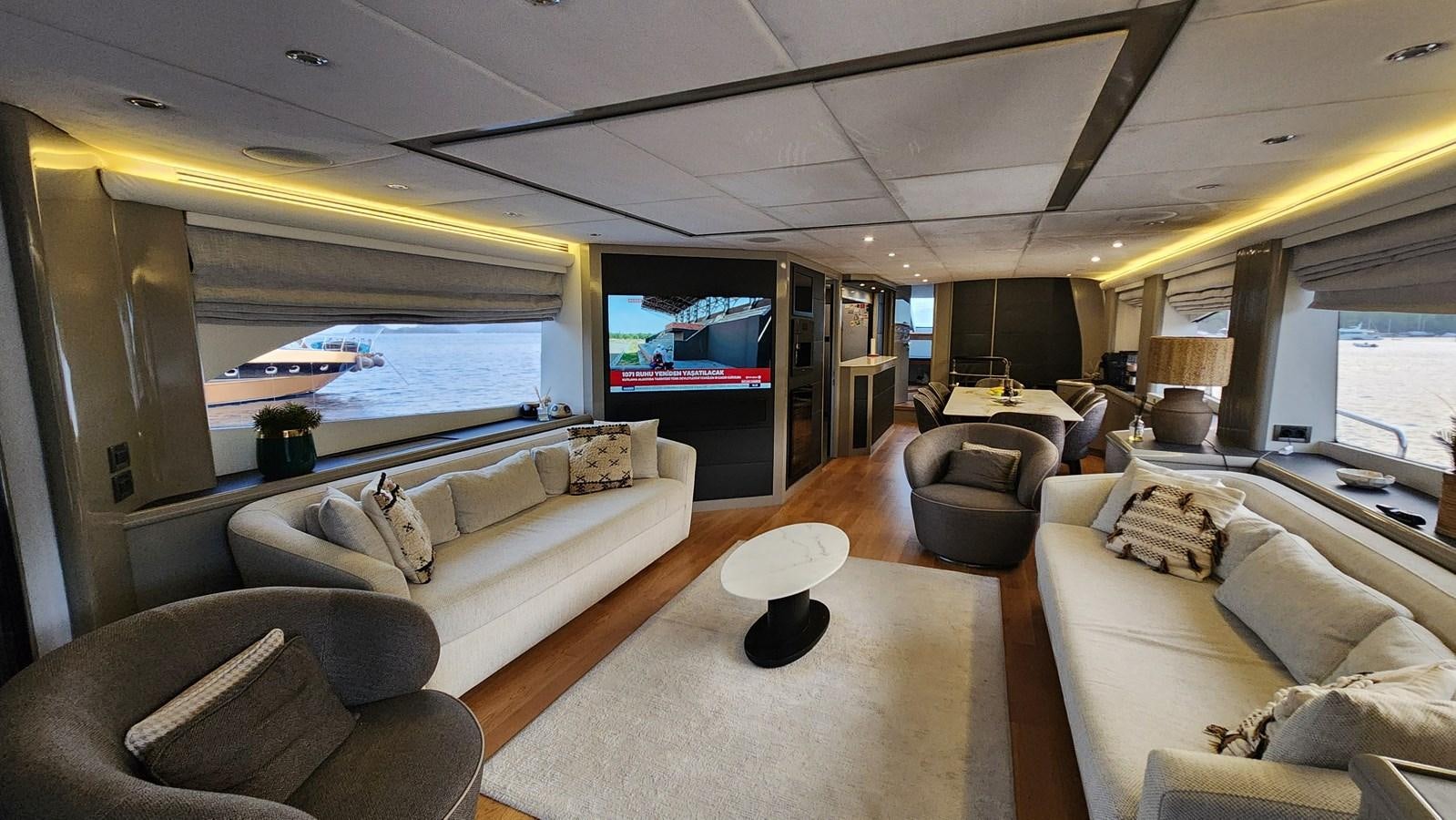 a living room with a large window aboard SPACE ODDITY Yacht for Sale