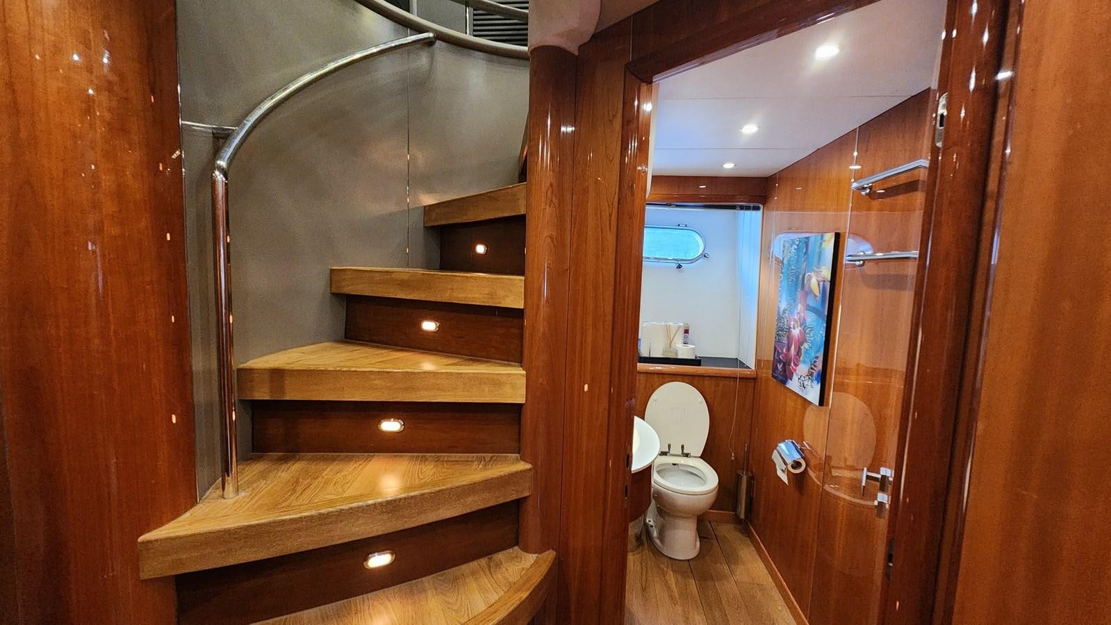 a bathroom with wood walls aboard SPACE ODDITY Yacht for Sale