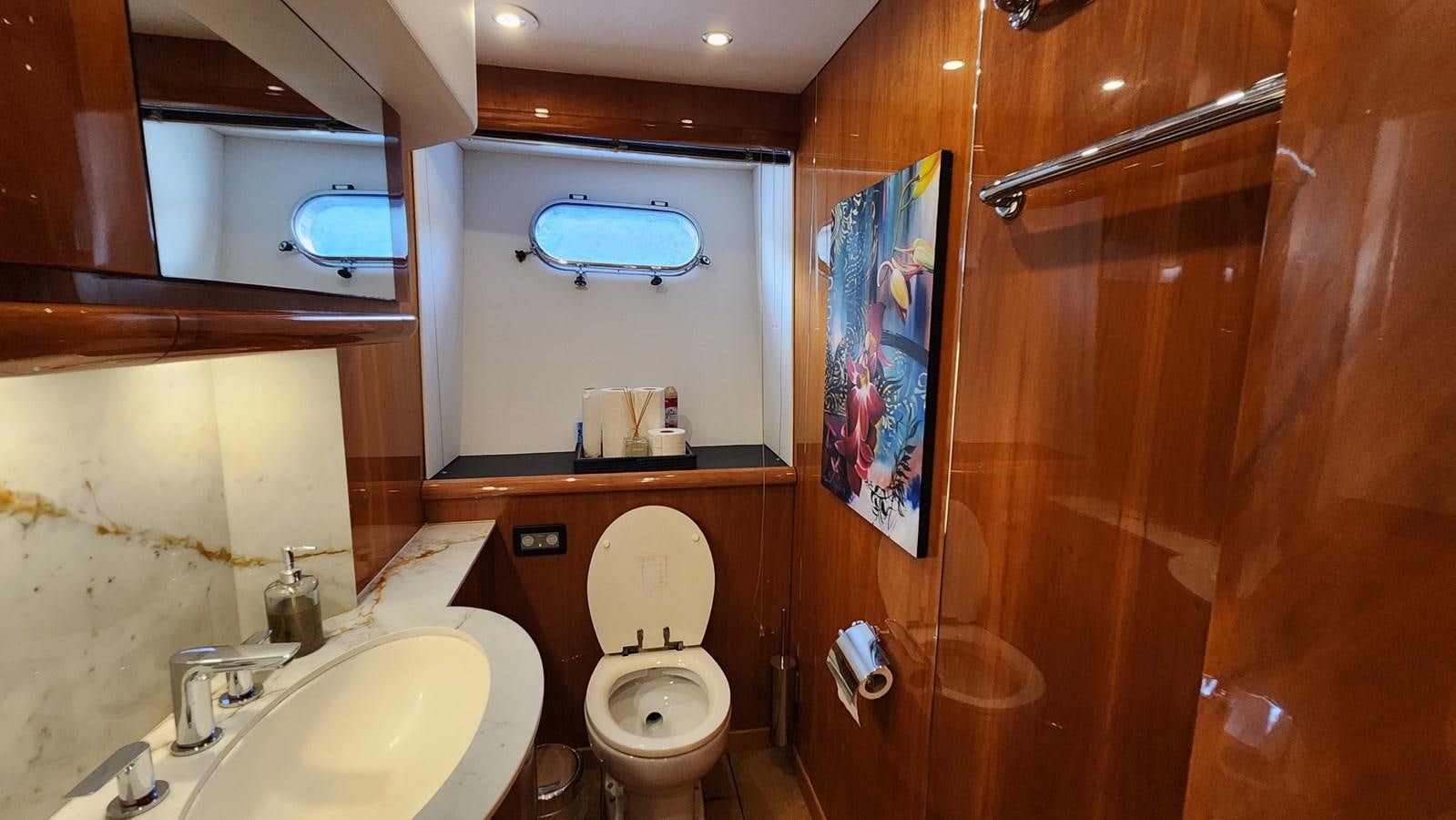 a bathroom with a toilet and sink aboard SPACE ODDITY Yacht for Sale