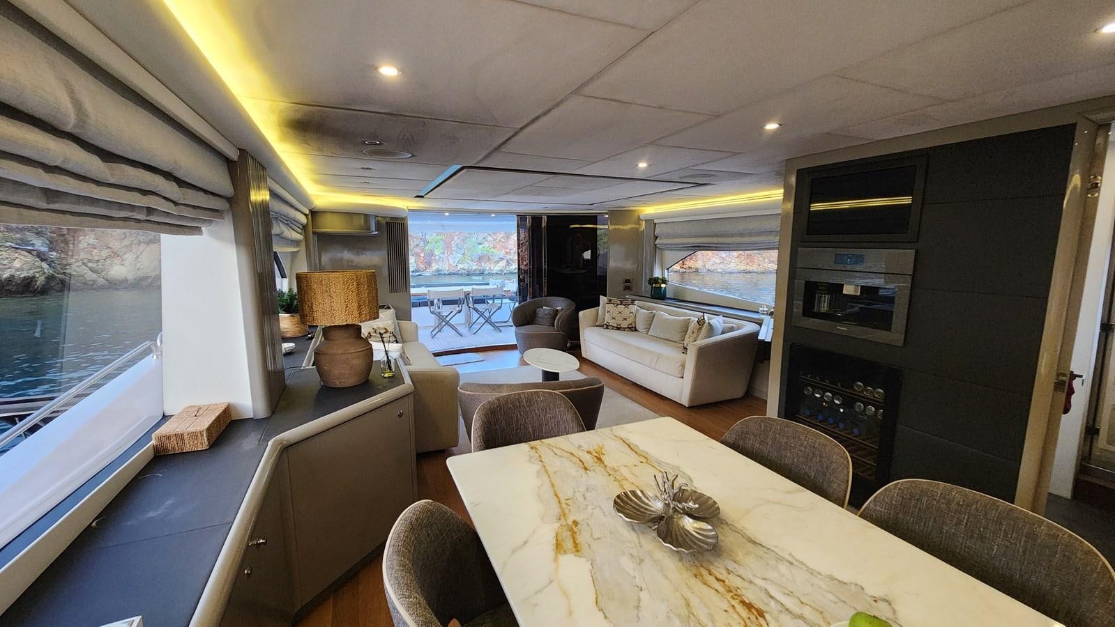 a living room with a large window aboard SPACE ODDITY Yacht for Sale