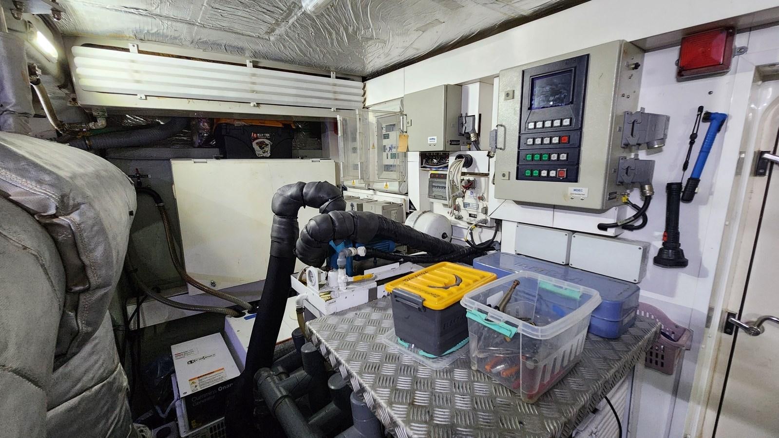 a room with a machine and equipment aboard SPACE ODDITY Yacht for Sale