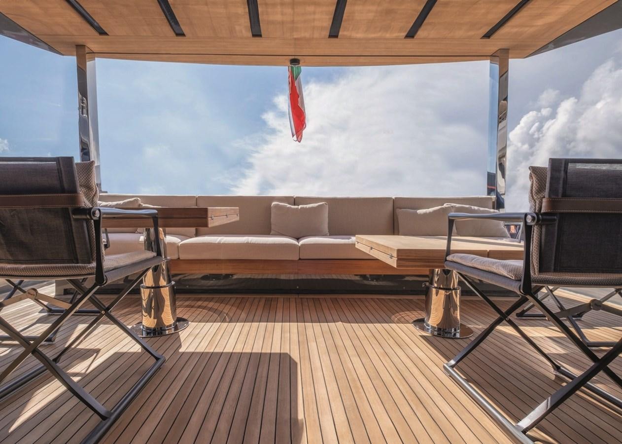 a living room with a large screen aboard NADA Yacht for Sale