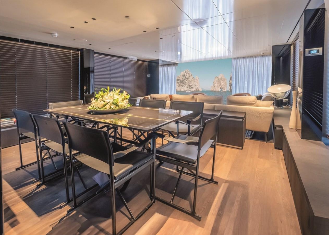 a large dining table in a room aboard NADA Yacht for Sale