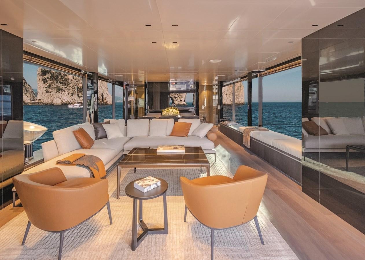 a living room with a large glass window aboard NADA Yacht for Sale